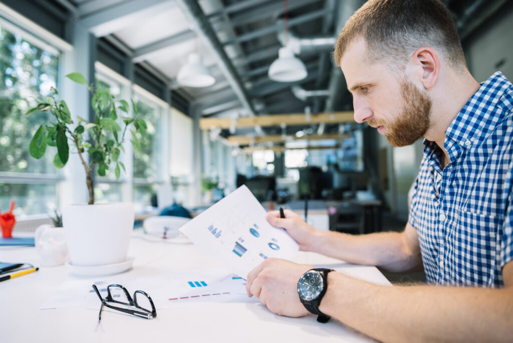 Pensive man looking at finances